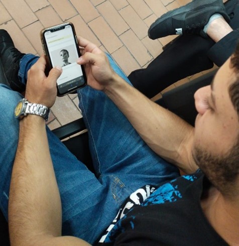 A student is watching his phone.